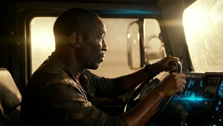A man driving a truck at dusk, then an old photograph of a child